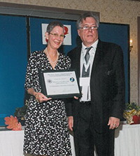 Image of Penny Jones Receiving and Award Plaque