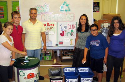 Image of Phil Infantolino poses with some other recycling enthusiasts at a Florham Park school.