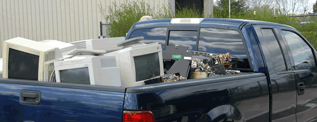 Image of TVs and computers on pallets