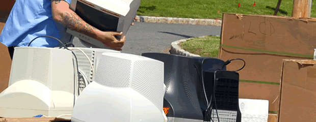 Image of TVs and computers on pallets