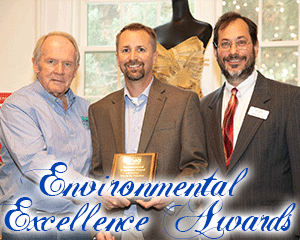 image of Eric Gabrielson accepting award from Gene Feyl and Larry Gindoff